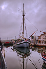Cesenatico canal, historic wooden sailing boats.