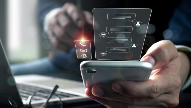Conversation assistant, digital chatbot, robot application, artificial intelligence (AI), and customer service idea. Man utilizing smart phone with contact us interface and digital chatbot Talk.
