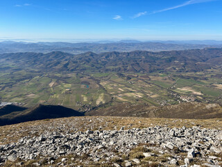 Panoramic view from the peak of Mount Cucco in Umbria region, Italy - 745282227