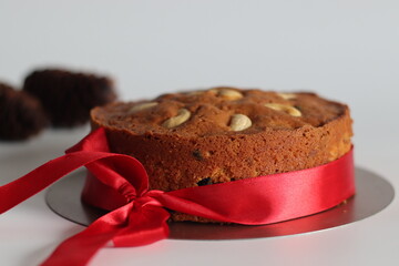 Christmas fruit cake with rum-soaked raisins, as festive dessert is perfect for holiday parties and family gathering, featuring rich textures