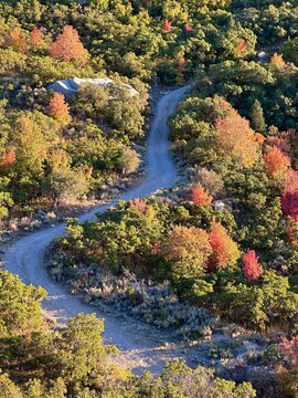 Aerial view of gravel footpath through autumnal mountain landscape, Sandy, Salt Lake City, Utah, USA