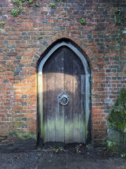 Antique Historic Secret Door in a Stone Wall
