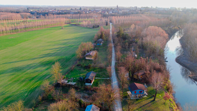 Aerial view of houses along Tanaro river, Bassignana, Alessandria, Piedmont, Italy
