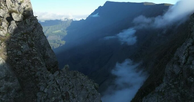 High-altitude drone footage showcasing R&eacute;union Island&rsquo;s wild volcanic formations, sharp rocky summits and expansive views across the deep mountain valleys.