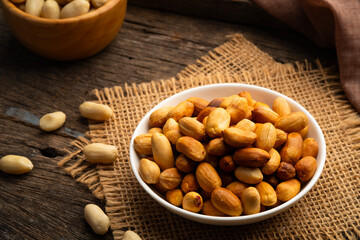 Close up Air fryer Roasted peeled peanuts in white plate.rich in protein,fat,and fiber