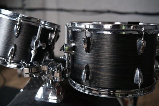 Professional Drummer Playing Drums, Closeup View  
The drummer knocks and beats, Repetition of rock or metal music band. Music 