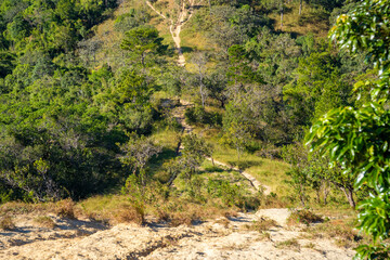 Ta Nang - Phan Dung route with milestone between 3 provinces through grass hills and forests in...