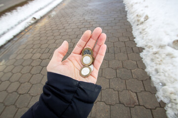 Belarusian coins in womans hand closeup, outdoors