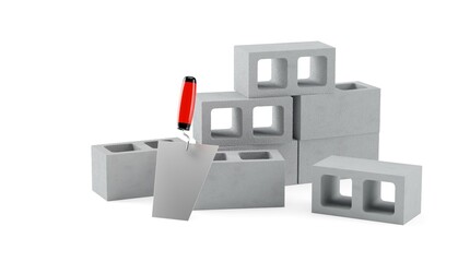 Group of gray concrete or cement brick stones with trowel stacked on white background, construction, building trade or masonry industry concept