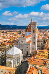 Vertical aerial cityscape view on the dome of Santa Maria del Fiore church and old town in Florence