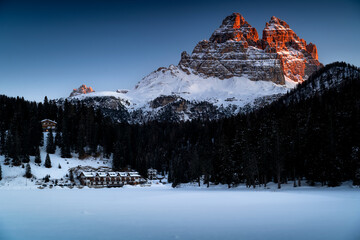 The most famous peaks of the Dolomites in the first rays of the sun. Tre Cime di Lavaredo, near...