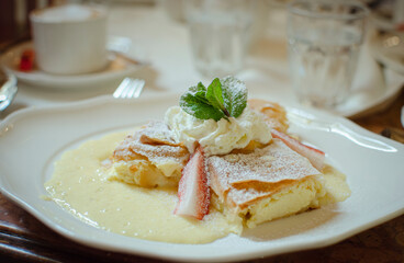 creamiest  cremsnit, cremeschnitte appetizing dessert with vanilla cream and strawberries