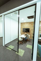 Focused work in a modern glass-walled office