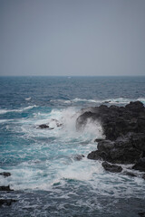 Blue sea and black rock.
The basalt and sea are beautiful.