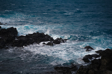 Blue sea and black rock.
The basalt and sea are beautiful.