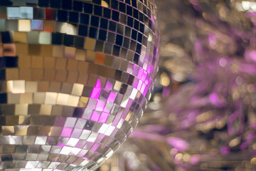 Shiny disco ball in pink tones closeup