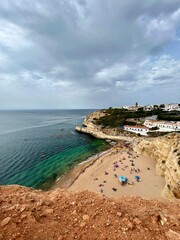 Amazing sand beach at the rocky ocean coast