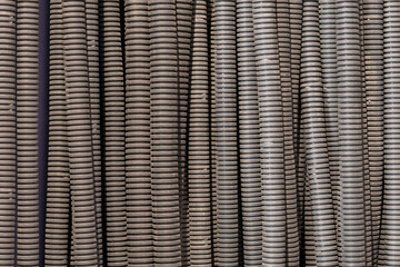 Close-up: Electrical conduits neatly align, guiding cables with precision. Structured arrangement showcases efficient wiring infrastructure.