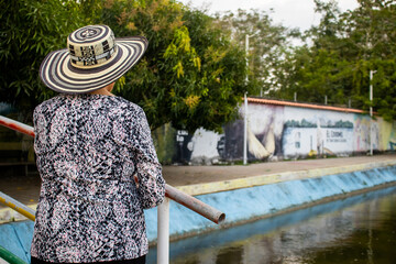 Senior woman tourist at the Macondo Linear Park in Aracataca the birthplace of the Colombian...