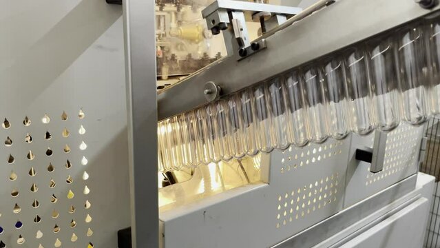 Preforms on the line entering heating zone.