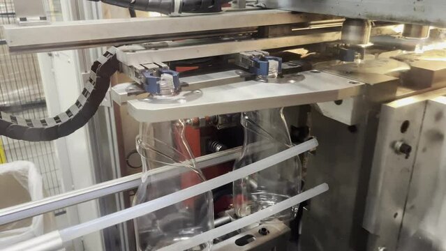 Plastic bottles for liquid detergens leaving blow machine in factory