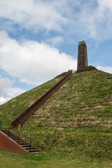 Pyramid of Austerlitz Utrecht Netherlands on sunny day. Stepped monument mound made from earth by Napoleon's forces. High vantage point with observation lookout obelisk now tourist attraction 