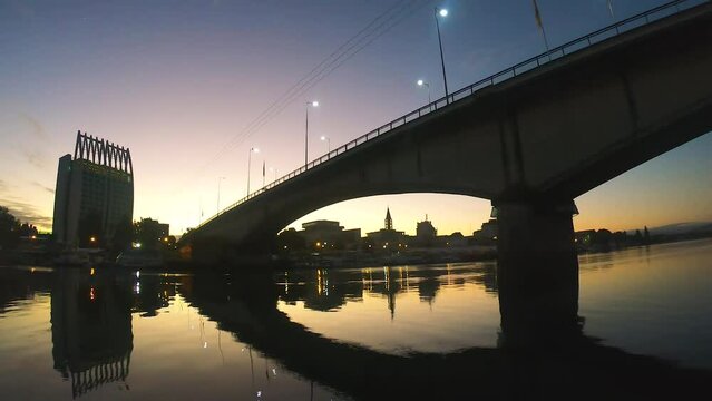 Boat ride under the Pedro de Valdivia bridge at dawn