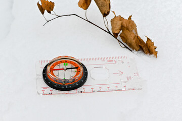 A compass in the snow.