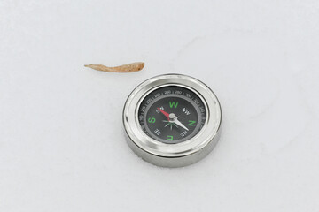 A compass in the snow.