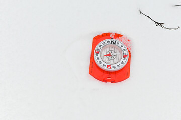 A compass in the snow.