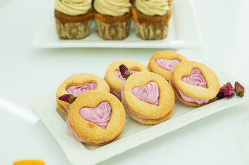 Desserts for the holiday, shortbread cookies in the shape of a heart with marshmallows