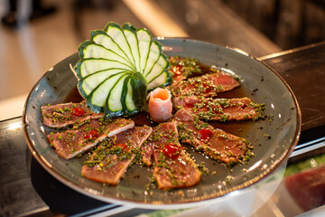 Fresh marinated tuna sashimi served on a elegant sushi plate
