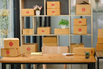 Obraz na płótnie Canvas Cardboard box on workplace at home. Start up small business.