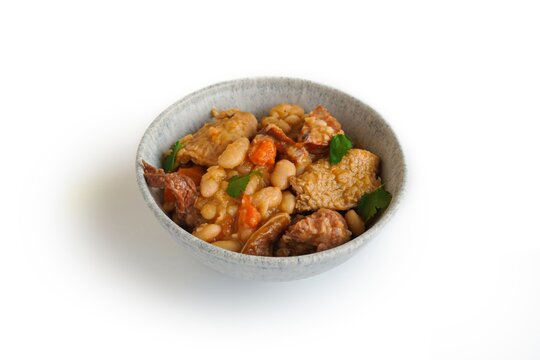 Tripas a Moda do Porto - pork tripe stew with white beans and smoked sausages in a bowl