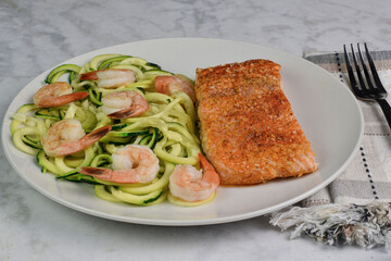 baked seasoned salom served with zucchini noodles