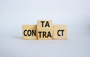 Contact and Contract symbol. Wooden cubes with words Contract and Contact. Beautiful white background. Contact and Contract and business concept. Copy space