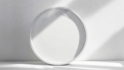 On a white wall with soft shadows there is a round flat mockup for advertising products