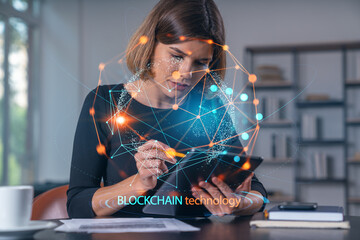 Businesswoman holding tablet device, touching. Office workplace. Blockchain hologram. Concept of distant work, business education, information technology.