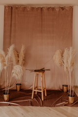 Scandinavian interior of photozone constant pink warm colors with fabric curtain.