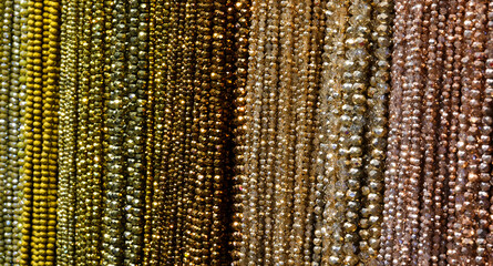 backdrop of golden yellow necklaces on sale at the jewelry store