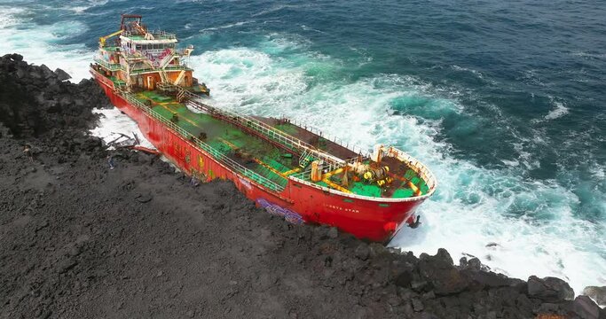 Saint Philippe, Reunion island, Tanker Tresta Star stranded on lava shore in Reunion island after Batsirai hurricane