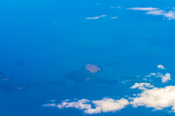 Flying in an airplane somewhere over the landscape of Costa Rica.