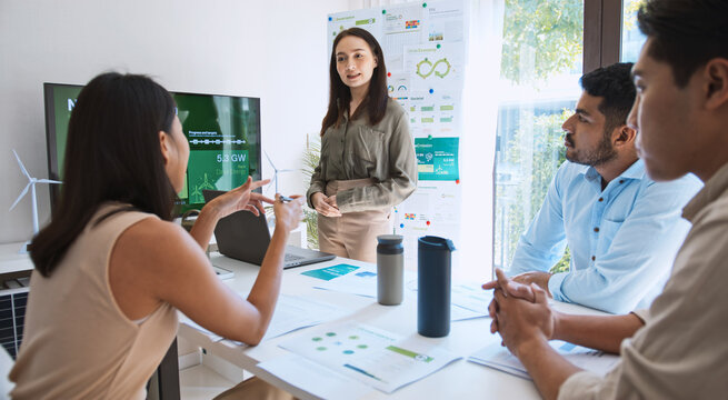 Asian woman lead young group of multiethnic businesspeople in team meeting, using laptop computer for ESG topic presentation on monitor. Sustainable business practice, people work at home concept