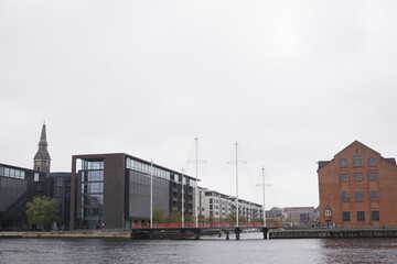 Fototapeta na wymiar View on modern architecture bridge Cirkelbroen at Christianshavn in Copenhagen, Denmark