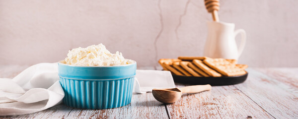 Traditional mascarpone cheese in a bowl on the table web banner
