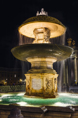 Fountain on the Saint Peter Square by night. Vatican. Rome