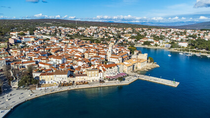 Aerial view of the enchanting town of Krk on the island of Krk in Croatia, captured from a drone.