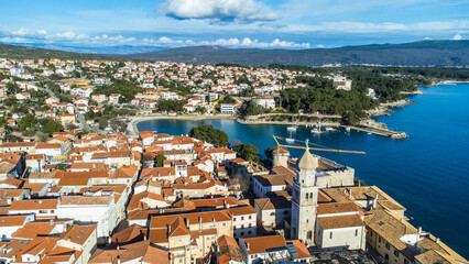 Obraz premium Aerial view of the enchanting town of Krk on the island of Krk in Croatia, captured from a drone.