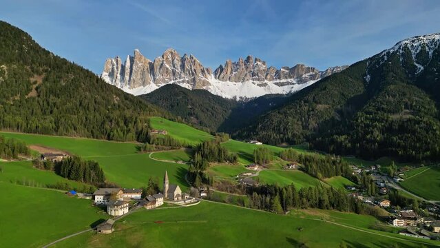 Spring landscape with Santa Magdalena village, Italian Dolomites Alps, in South Tyrol, Val di Funes, Italy, 4k