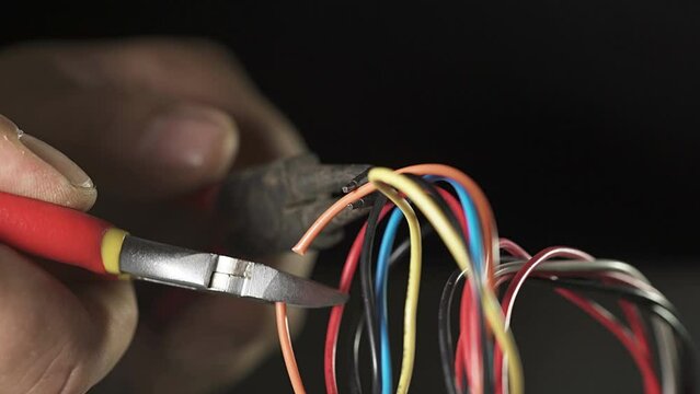 cutting the orange cable with scissors: defuse a bomb; repair an electric tool